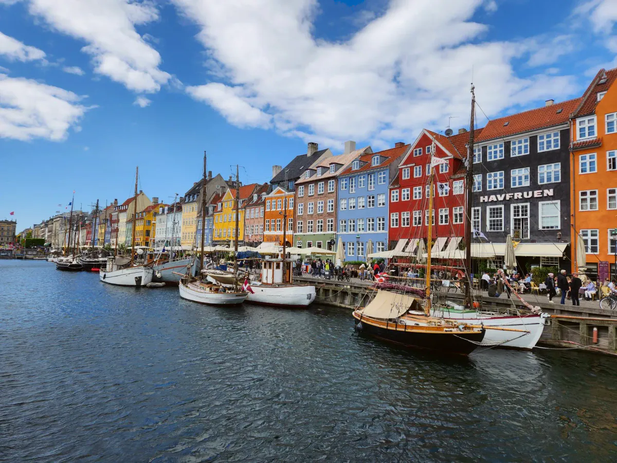 Colourful houses and old wooden ships along the canal in Nyhavn